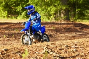 TT-R110E riding on a dirt road