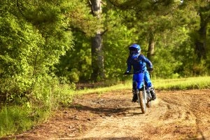 TT-R110E coming toward you on a dirt road - far